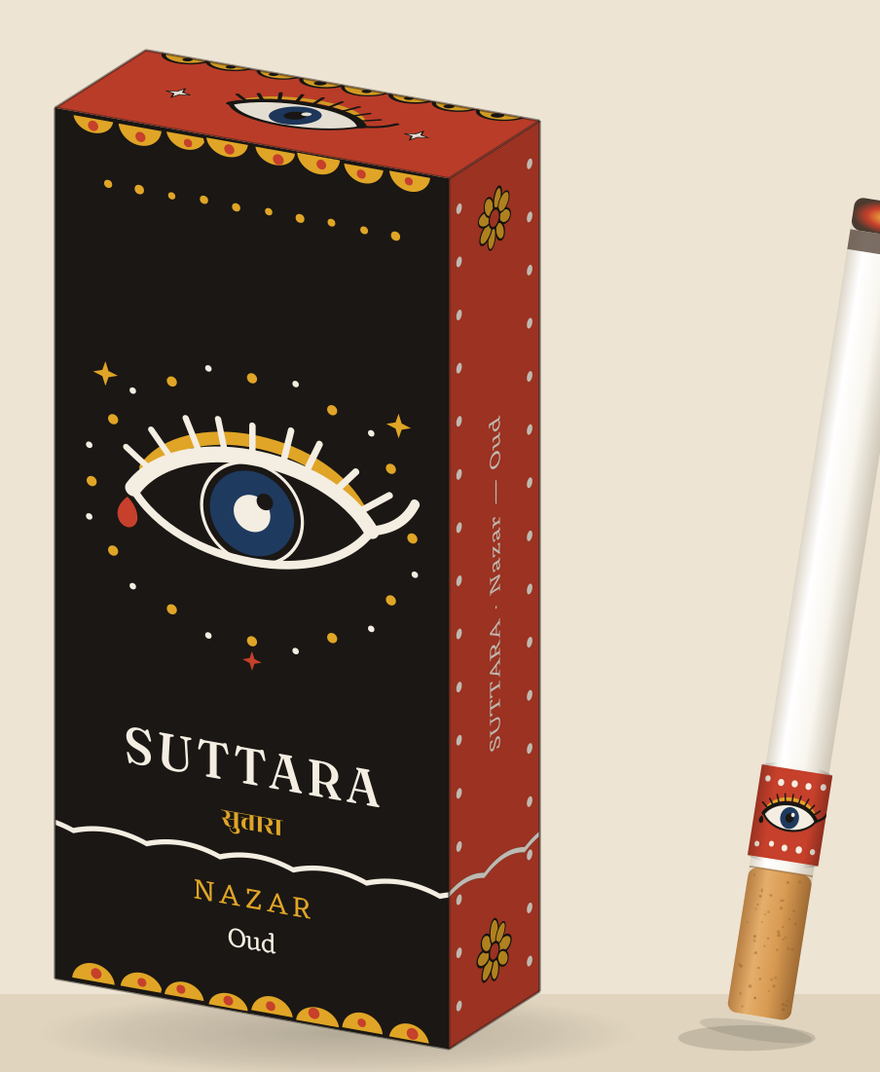 Nazar box — kohl black with one large guardian eye — beside a lit stick wearing the red eye band